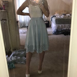 Baby blue midi skirt with eyelet trim bottom.